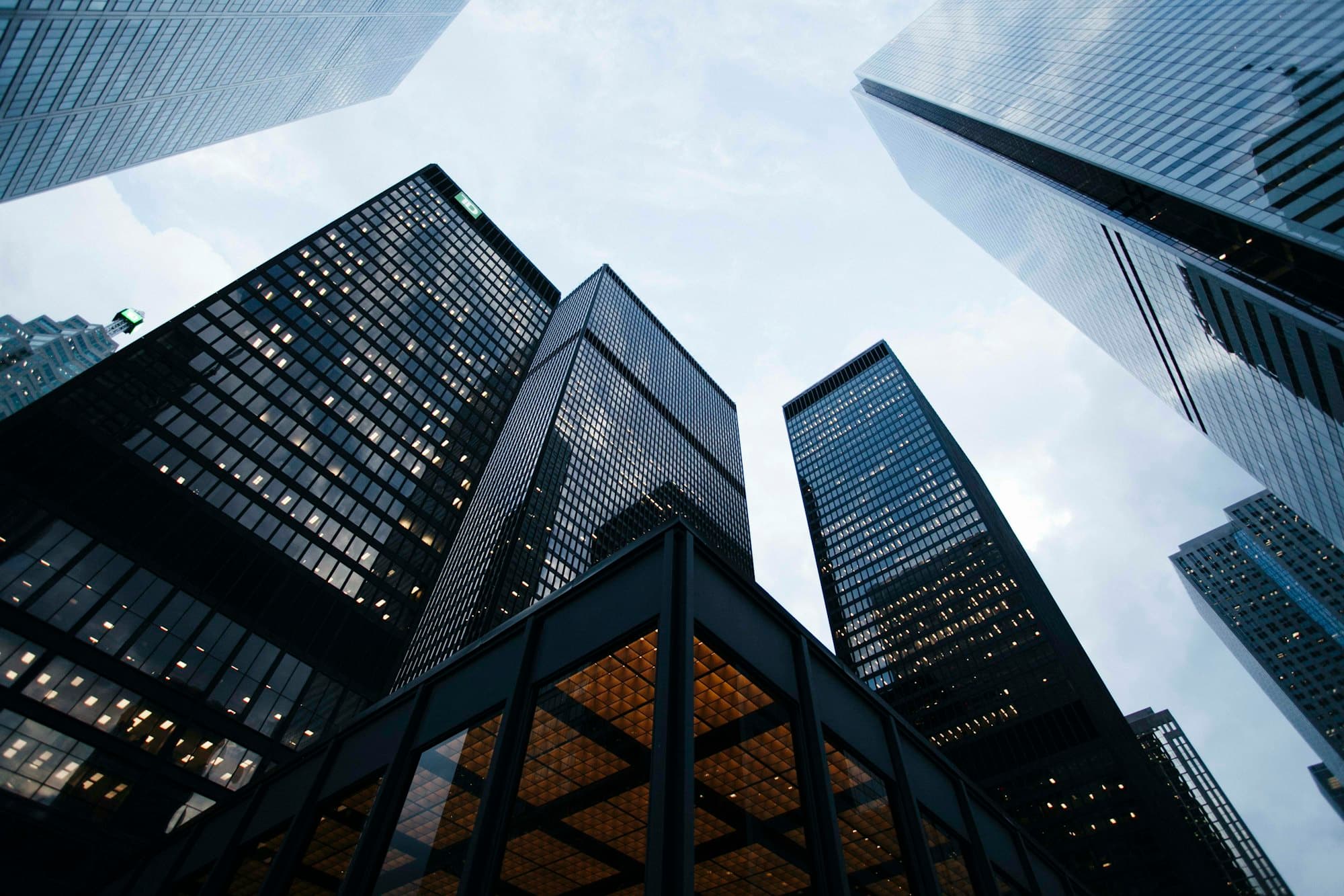 Tall buildings seen from below at night